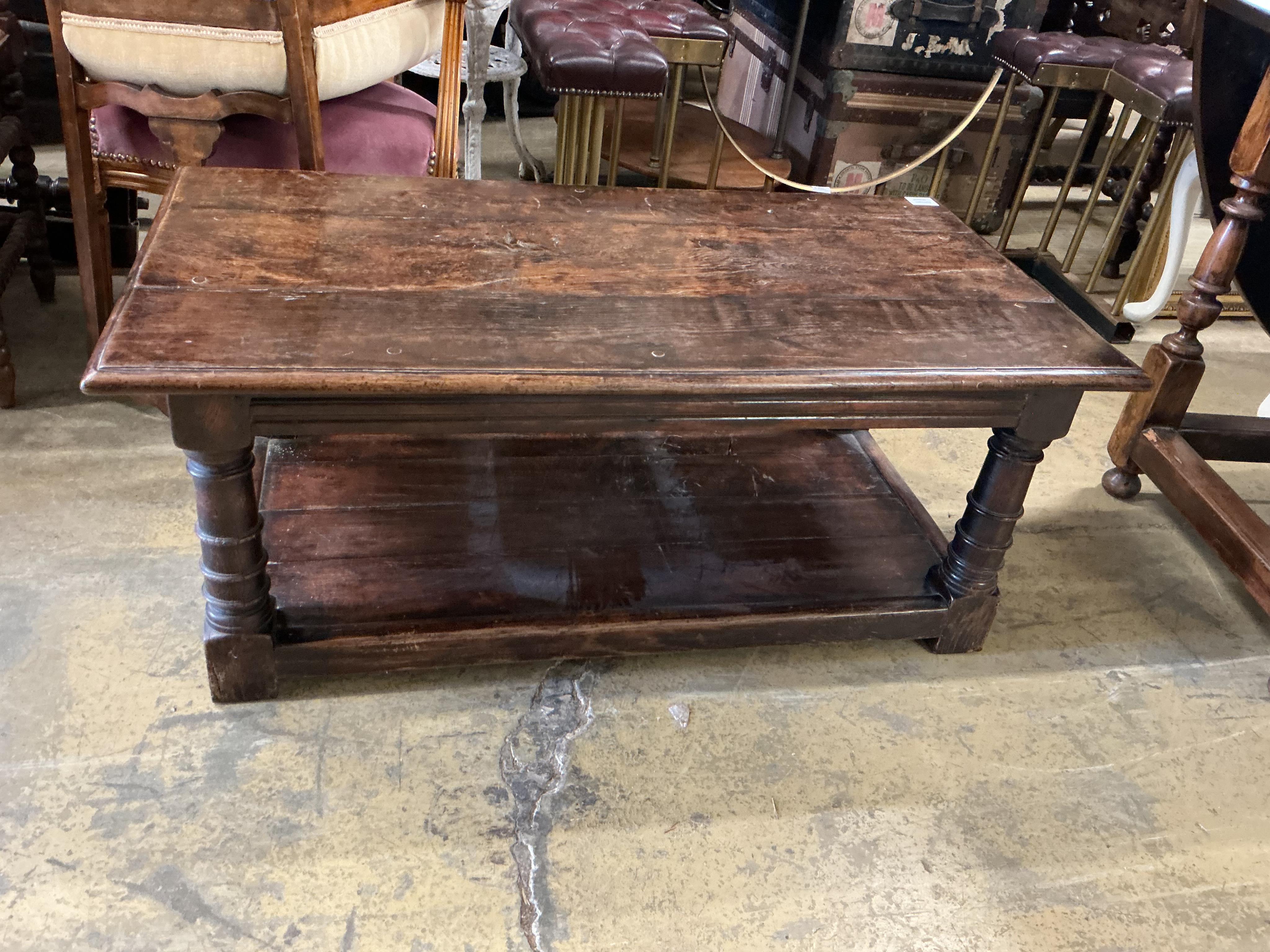 A 17th century style rectangular oak two tier coffee table, width 106c, depth 55cm, height 43cm